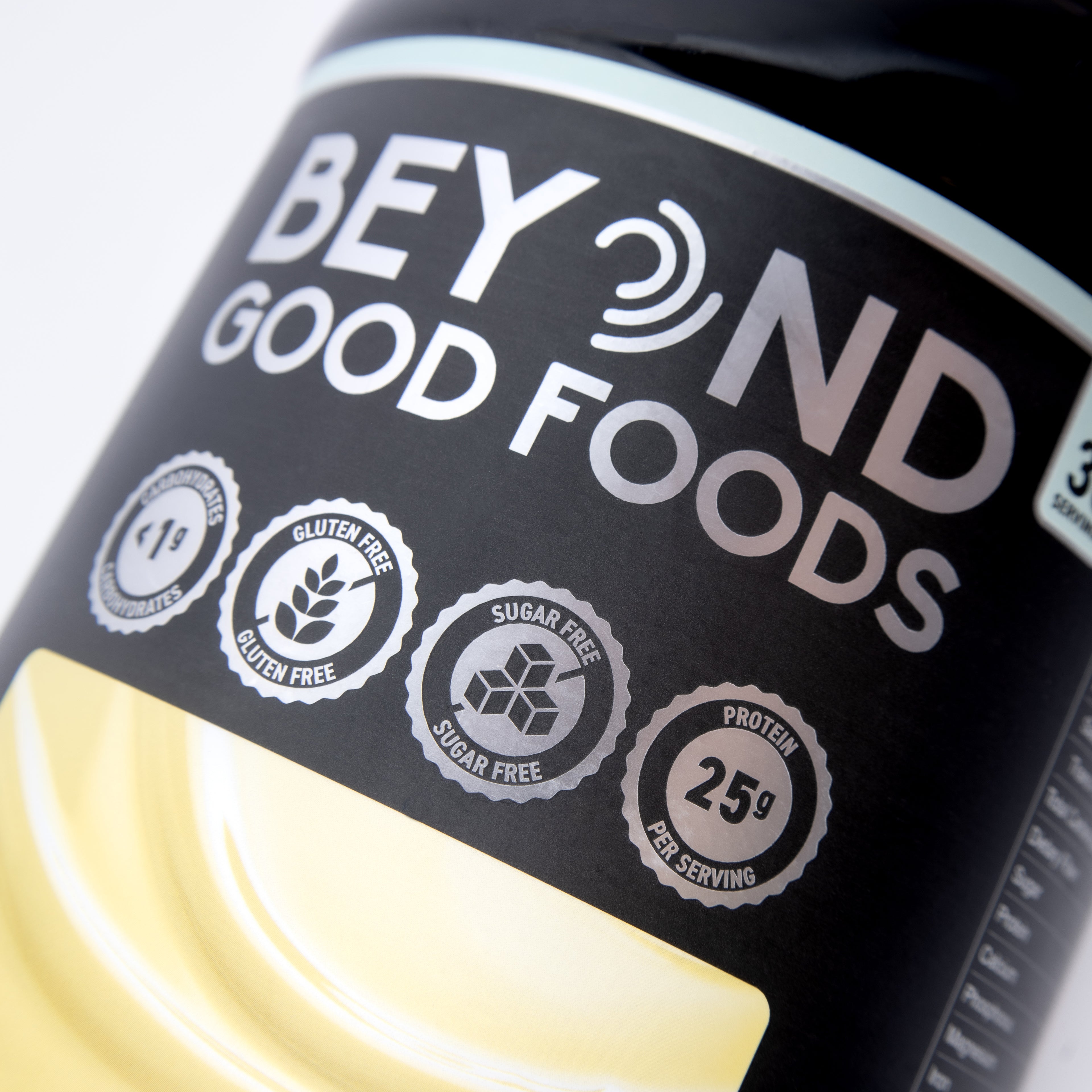 Bottle of Beyond Good Foods protein powder with visible branding and nutritional information.