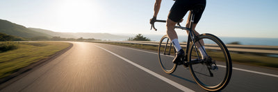 Cyclist riding on scenic American road.