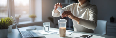 Preparing a vegan protein shake at work.