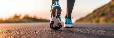 Vegan athlete running on outdoor path.