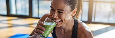 Athlete drinking a vegan protein smoothie.