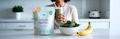 Person enjoying a vegan protein smoothie