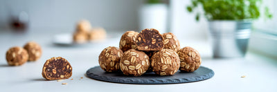 Homemade vegan protein energy bites on plate.