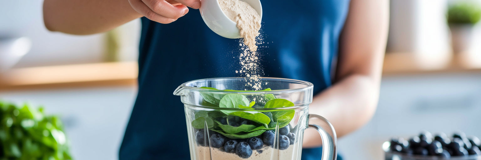 Pouring vegan protein powder into a blender.