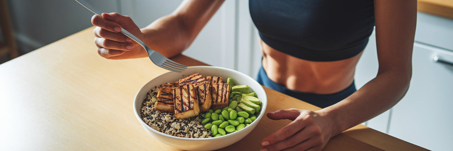 Athlete eating a healthy vegan protein bowl.
