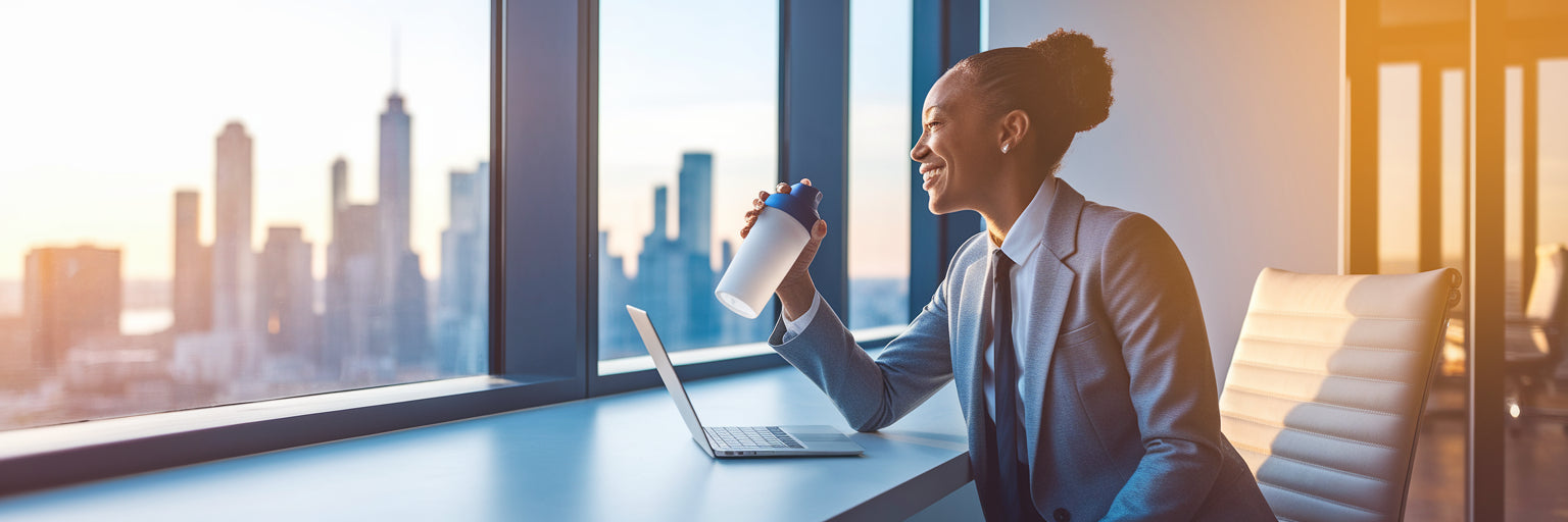Professional feeling energized at office desk.