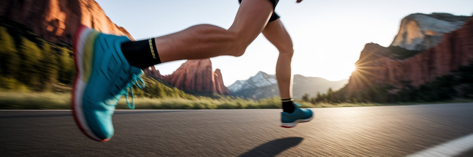 Runner's legs on a park trail.