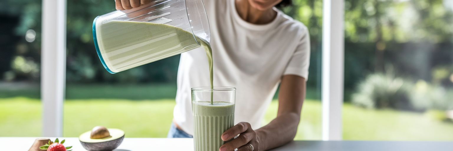 Person pouring a healthy vegan smoothie.