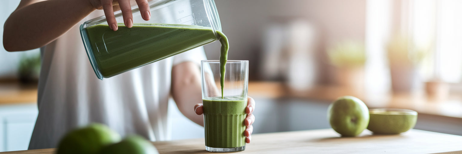 Person pouring a healthy green smoothie.