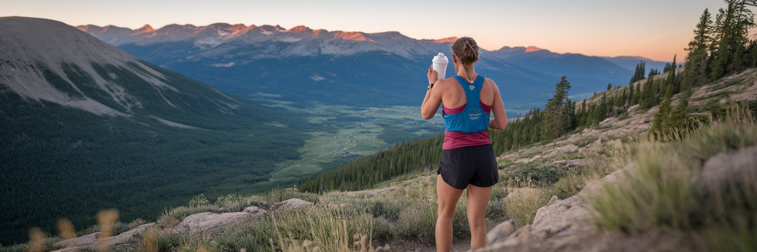Trail runner recovering with protein shake.