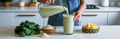 Pouring a healthy vegan protein smoothie.