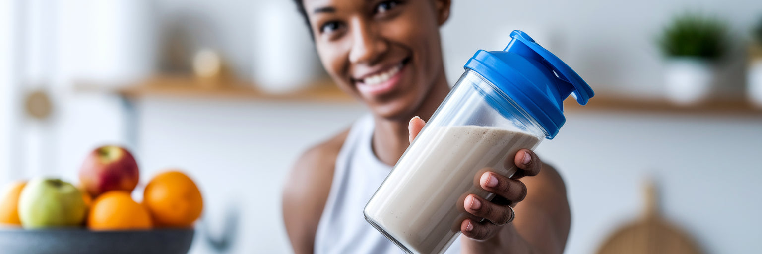 Person holding a vegan protein shake.
