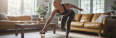 Fit older person reaching for protein shake.