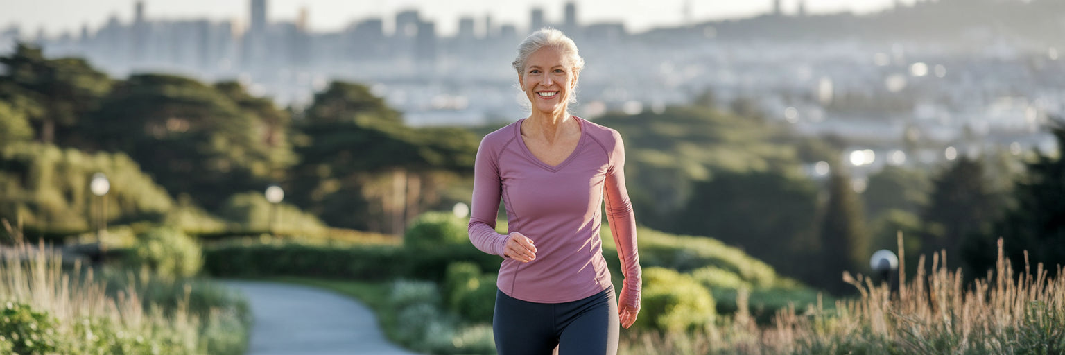 Healthy woman over 50 walking in a park.