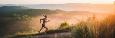 Runner on trail at sunrise