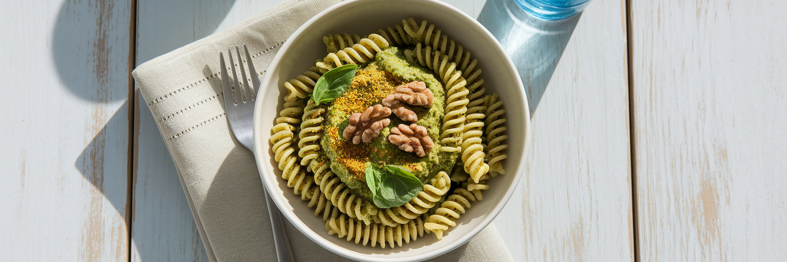Bowl of high-protein vegan pesto pasta.