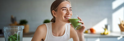Woman with clear skin drinking smoothie.