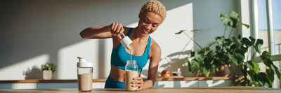 Person preparing a vegan protein shake