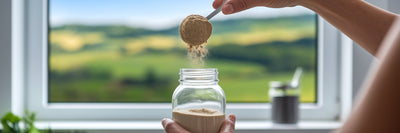 Preparing vegan protein shake with green landscape.