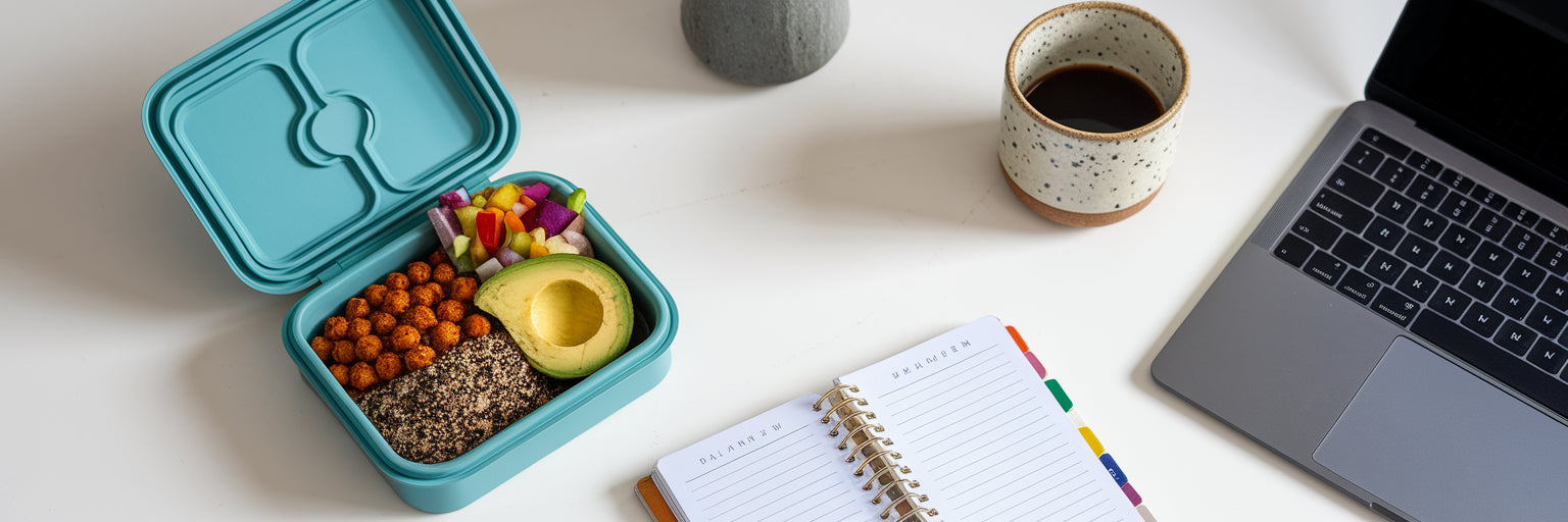 Healthy plant-based lunch on work desk.