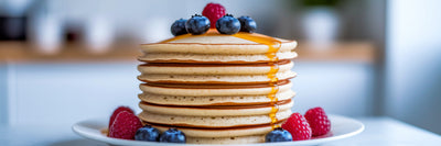 Fluffy vegan protein pancakes with berries